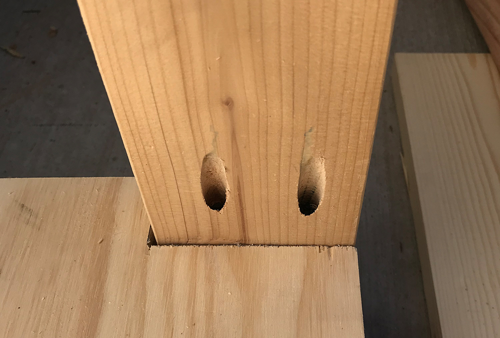 wood assembled perpendicularly with screws holding the angle